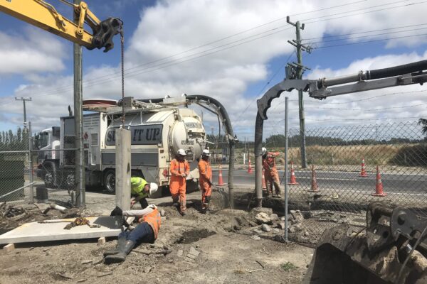 Civil works team installing pipe connections in Canterbury