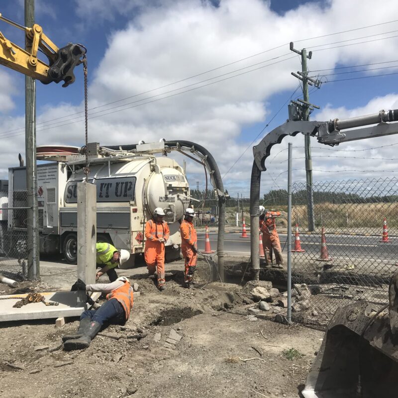 Civil works team installing pipe connections in Canterbury
